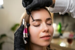 Portrait of a girl while styling her eyebrows in a salon